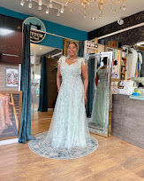 A lady is trying his alterated dress